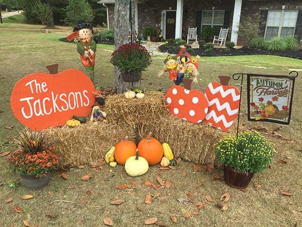 Set up beside porch to the right..Make pumpkins with plywood. Buy plant hanger.